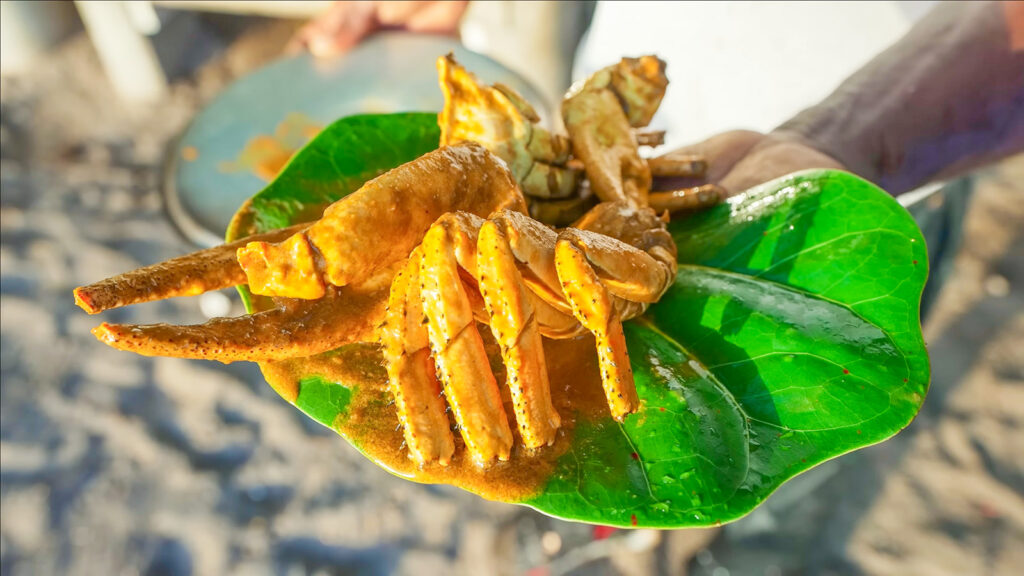 A giant curry crab on a leaf on a beach in Dominica | Davidsbeenhere