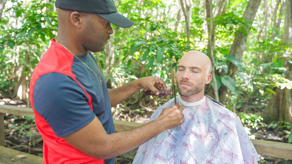 Darryl trims David Hoffmann's beard at The Bush Bar in the jungles near Portsmouth, Dominica | Davidsbeenhere