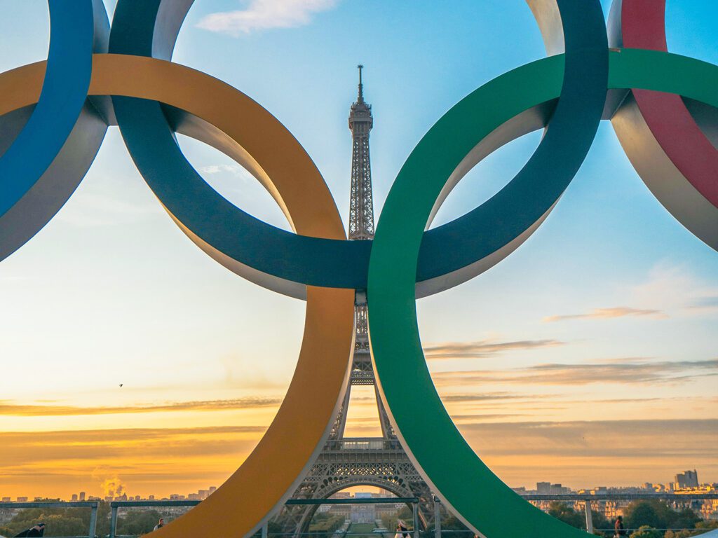 The Olympic rings commemorating the Paris Olympics in front of the iconic Eiffel Tower | Davidsbeenhere