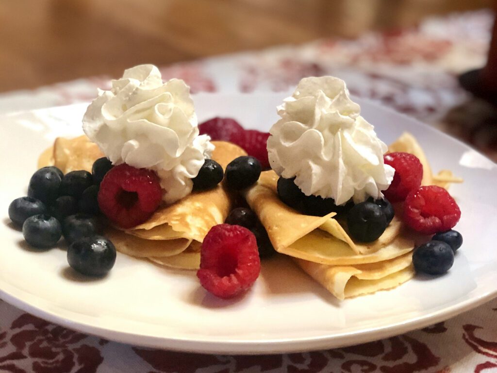 Crepes with fresh blueberries, raspberries, and whipped cream are the perfect 2024 Olympics snack | Davidsbeenhere